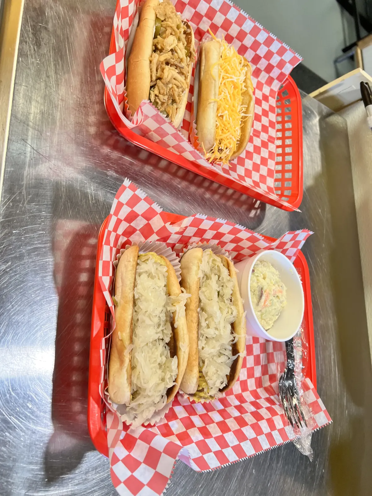 Two baskets of kraut dogs with coleslaw